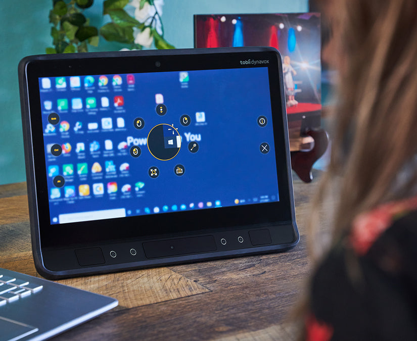 Woman using Tobii Dynavox TD Control on an I-Series eye gaze-enabled speech generating device