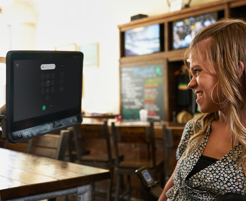 Delaina using TD Phone to make a call on a Tobii Dynavox I-Series eye tracking speech device